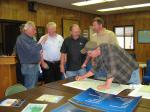 Attendees look at state map and mark potential areas for energy development